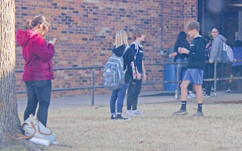 (FILE PHOTO | THE GRAHAM LEADER) Students outside of the Graham Junior High School campus in 2022. Graham ISD implemented a policy where students will be placed in a Disciplinary Alternative Education Program if found in possession of e-cigarettes, vaping, marijuana and THC-related products.