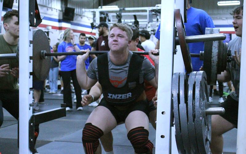 (TC GORDON | THE GRAHAM LEADER) Graham’s Scout Smith pushes back up during the finish of his squat lift during a powerlifting competition the Steers hosted last Thursday, Feb. 8.