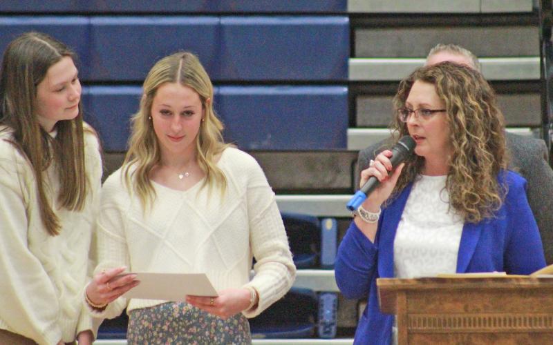 (TC GORDON | THE GRAHAM LEADER) Lady Blues volleyball head coach Marci Faulk (right) presents awards to members of the volleyball team at the fall sports banquet held Monday, Jan. 15.