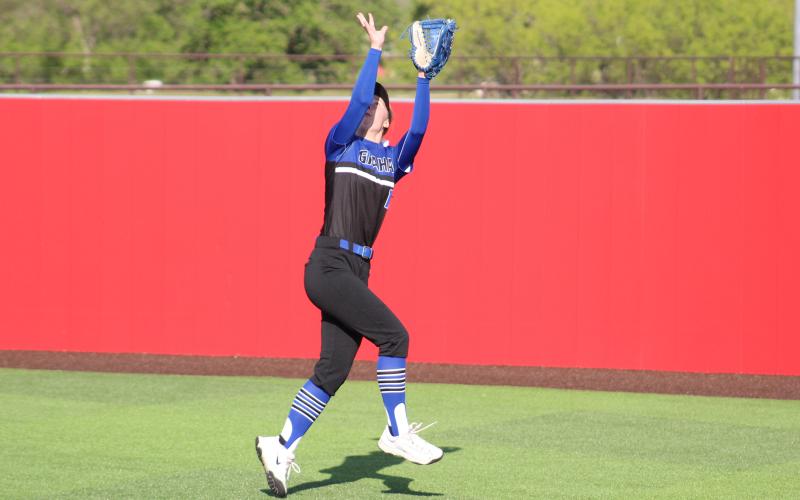 (TC GORDON | THE GRAHAM LEADER) Right fielder Larissa Warren makes an acrobatic catch in the outfield that eventually turned into a double play which saved a run in Graham’s game against Stephenville this past Wednesday, April 10. The Lady Blues defeated the Honeybees 3-1.