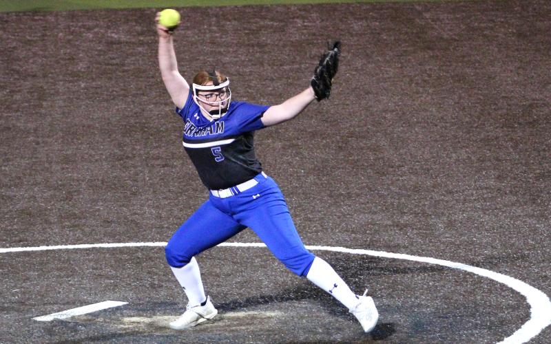 (TC GORDON | THE GRAHAM LEADER) Reese Calhoun winds up and lets a pitch fly during the Lady Blues’ season-opening win over City View this past Tuesday, Feb. 13. Graham won 11-0 and Calhoun pitched all five innings, in which she struck out 12 opposing hitters.