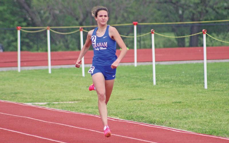 (TC GORDON | THE GRAHAM LEADER) Sophia Schlieper sprints towards the finish line at the district track meet in Mineral Wells. The senior was named first team academic all-state.