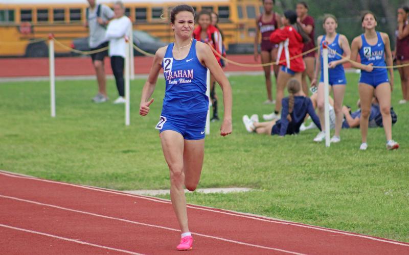 (TC GORDON | THE GRAHAM LEADER) Graham’s Sophie Schlieper sprints for the finish line during a preliminary race Monday, April 1 at the District 6-4A track meet in Mineral Wells. Schlieper qualified for the area track meet with a fourth place finish in the 200-meter dash.