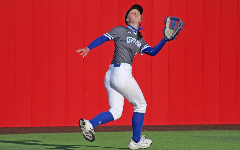 (TC GORDON | THE GRAHAM LEADER) Graham outfielder Larissa Warren tracks a fly ball in the air during warmups before the Lady Blues’ dominant 12-0 win over the Mineral Wells Lady Rams this past Tuesday, April 2.