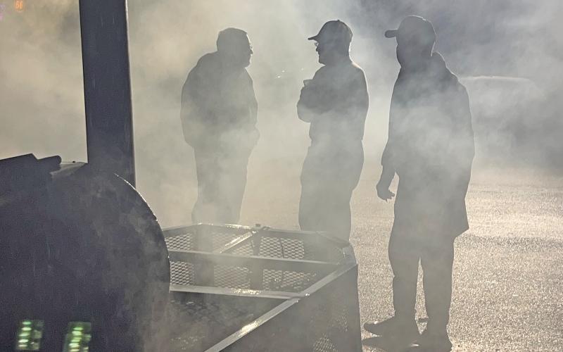 (SHERMAN MARSH | CONTRIBUTED PHOTO) Members of the Young County Masonic Lodge #485 stand by a smoker which they used to cook turkeys from Thursday, Dec. 21 to early Friday, Dec. 22. The organization cooked a total of 164 turkeys for the community.