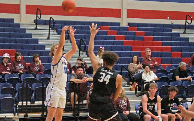 (TC GORDON | THE GRAHAM LEADER) Kolby Spurlin shoots a 3-pointer over the outstretched hand of a Millsap defender during the Steers’ 66-38 win over the Bulldogs last Saturday, Dec. 30.