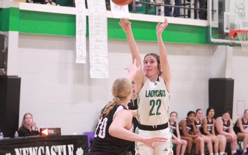 (TC GORDON | THE GRAHAM LEADER) Newcastle’s Mattie Dollar shoots a jump shot over a Throckmorton defender during the Ladycats’ 54-30 win over the Lady Hounds this past Tuesday, Jan. 2. Dollar recorded a double-double and scored 33 of her team’s 54 points in the win.
