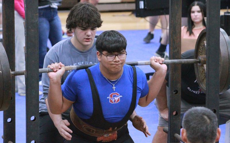 (TC GORDON | THE GRAHAM LEADER) Andrew Ramirez, of the Steers powerlifting team, goes down for his squat lift during the team’s competition against three other teams at Weatherford last Thursday, Jan. 11. The Steers finished in third place in the event.