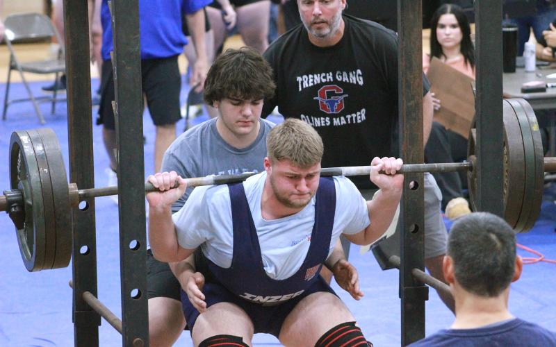 (TC GORDON | THE GRAHAM LEADER) Talan Yowell, of the Steers varsity powerlifting team, works his way back up in his squat lift during Graham’s first competition of the season. The Steers returned to Weatherford for their second competition Thursday, Jan. 25.