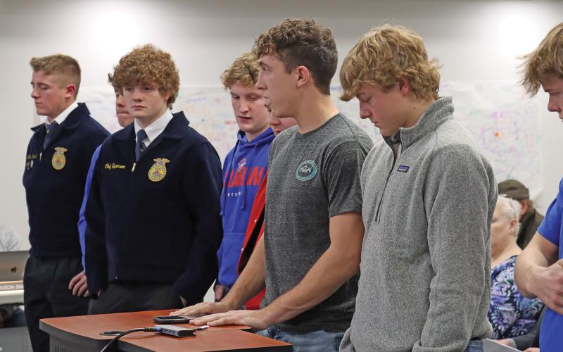(THOMAS WALLNER | THE GRAHAM LEADER) Ty Thompson (center) and other Graham High School athletes spoke in the public comment section of the Graham ISD Board of Trustees meeting Wednesday, Jan. 17. The group voiced their support for hiring Clay McChristian as the new athletic director and head football coach.