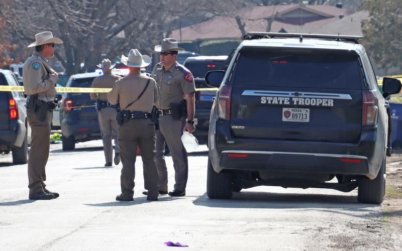 (THOMAS WALLNER | THE GRAHAM LEADER) A Texas Ranger speaks with two Game Wardens who responded to a shooting scene at Morado and Hillcrest Streets in Graham.