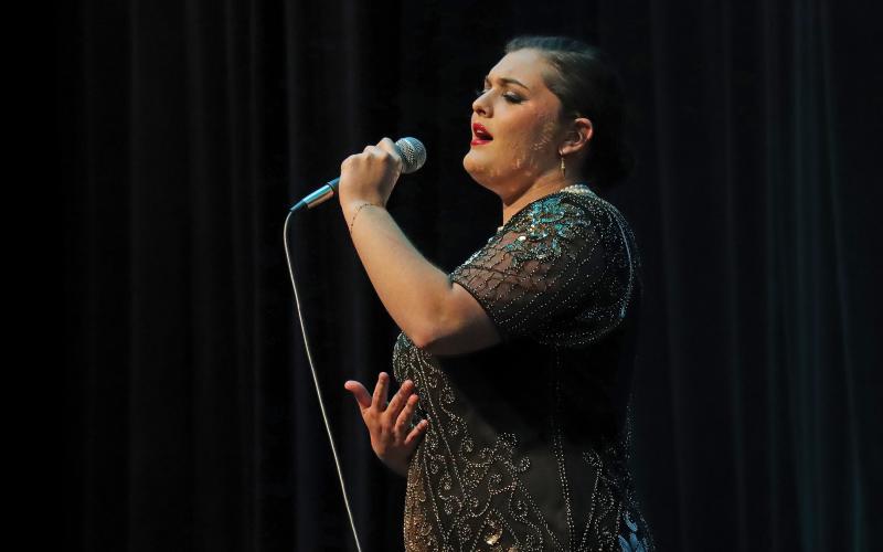 (THOMAS WALLNER | THE GRAHAM LEADER) Lainey Herring sings Skyfall by Adele during the talent  portion of the All-American Girl Pageant held Saturday, Feb. 24 at Memorial Auditorium in Graham. Following the talent portion was an introduction of the participants.