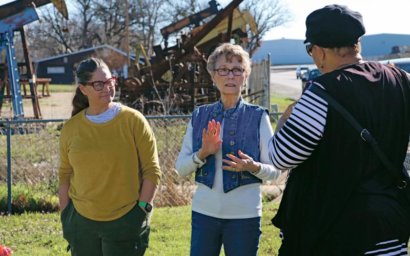 (KYLIE BAILEY | THE GRAHAM LEADER) Dr. Tamra Walters, Nancy Pettus, and Rev. Vanessa Sims speak at the Oak Grove Colored-William P. Johnston Memorial Cemetery during the first day of the Texas Tech University archaeological study.