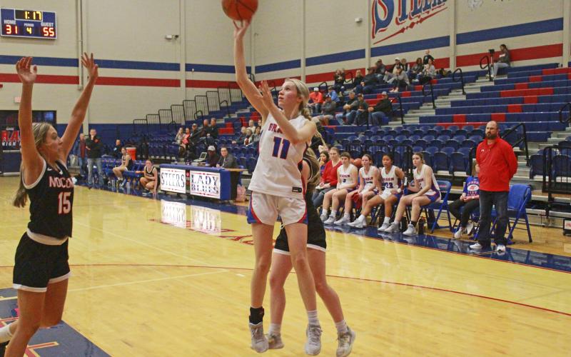 (TC GORDON | THE GRAHAM LEADER) The Lady Blues’ Maddie Franklin puts up a floater near the end of the game Friday, Nov. 17 when Graham took on Nocona. The Lady Blues lost to the Lady Indians 57-33.