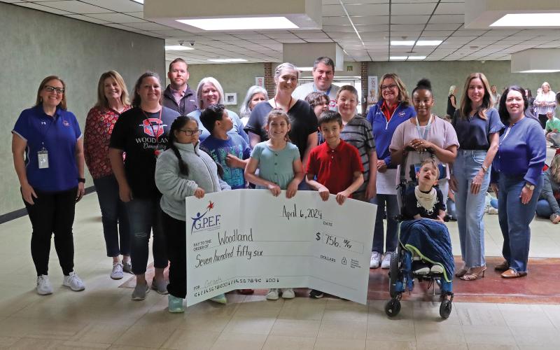 (THOMAS WALLNER | THE GRAHAM LEADER) Graham Public Education Foundation presented $756 to a teacher from Woodland Elementary School for the Kindness Crew Coffee Cart.