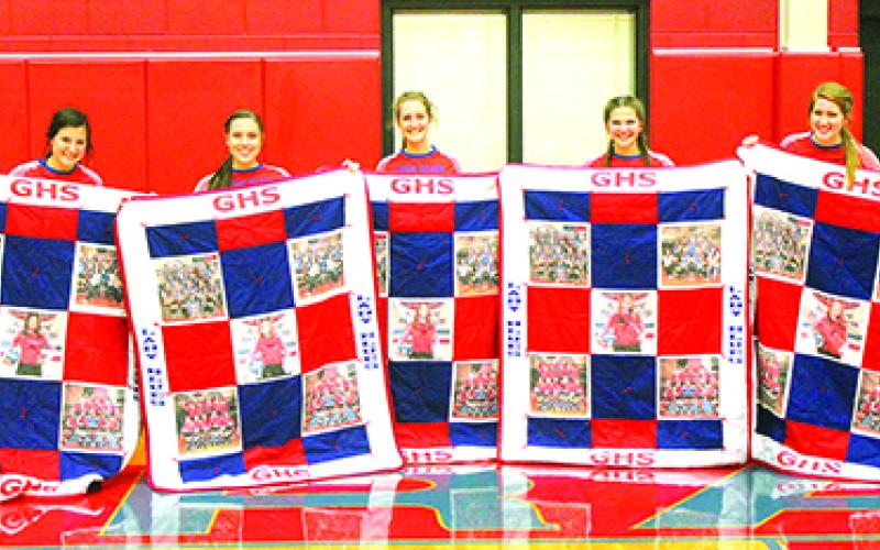 Tuesday night following the Graham High School varsity volleyball game, the five seniors on this seasons squad were presented with throw quilts. The quilts were made by Brenda Rinker, grandmother of senior Lady Blue Delaney Sullivent. Shown, l-r, are Lady Blues seniors Marleigh Sanders, Baylee Loomis, Emily Davis, Delaney Sullivent and Skylar Morris. Leader photo by Evan Grice