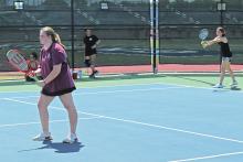 (FILE PHOTO | THE GRAHAM LEADER) Graham High School tennis players held practices in the week leading up to their opening matches. The GHS tennis team opened the season with a big win at Mineral Wells, 18-1, but fell to Denton High in their second match of the week, 7-12.