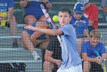 (TC GORDON | THE GRAHAM LEADER) Graham tennis player Brodey Mills keeps his eye on the ball as he prepares to return the hit in one of the varsity team’s recent matches.