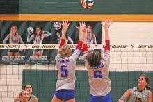 (TC GORDON | THE GRAHAM LEADER) Juniors Braylee Mayes (5) and Emilee Gordy (6) block a ball hit by a Boyd player in Graham’s game Tuesday, Aug. 22 against the Lady Jackets. The Lady Blues were swept in three sets by scores of 20-25, 21-25 and 19-25.