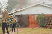 (TC GORDON | THE GRAHAM LEADER) First responders work a fire at 912 Fairview St. in Graham which occurred Tuesday, Jan. 23. The home belonged to Graham Police Department Officer Jennifer Hudson. The community has come out to support Hudson after the fire.