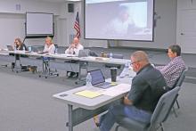 (THOMAS WALLNER | THE GRAHAM LEADER) GISD Financial Advisor, Jeff Robert, of Hilltop Securities, speaks remotely with the GISD Board of Trustees regarding setting a bond for the May 2024 election.