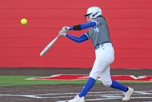 (TC GORDON | THE GRAHAM LEADER) The Lady Blues’ first baseman Peyton Dobbs connects with a pitch for a big hit during Graham’s district contest against Mineral Wells this past Tuesday, April 2. The Lady Blues dominated the visiting Lady Rams 12-0.