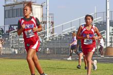 (KYLIE BAILEY | THE GRAHAM LEADER) Zoe Houston (349) finished 196th, with Emily Reyes Sanchez (357) finishing 195th, out of 216 runners Wednesday, Sept. 20 at the Wyatt Dickerson Invitational in Alvord.