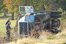 (ARCHIVE PHOTO | THE GRAHAM LEADER) Graham Fire Department Chief Jim Don Laurent and Texas Division of Emergency Management Young County Liaison Jarod Cook examine a truck which rolled over Tuesday, Nov. 14 in the 2900 block of Rocky Mound Road.