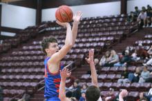 (TC GORDON | THE GRAHAM LEADER) Graham’s Cash Bowen elevates over a defender for a post jump shot during one of the team’s games earlier this season. On Tuesday, Jan. 2, the Steers traveled to Castleberry and defeated the Lions 74-46.