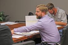 (TC GORDON | THE GRAHAM LEADER) Assistant City Manager Grant Ingram speaks at the Graham Economic Improvement Corporation meeting Thursday, Aug. 3. The GEIC Board of Directors approved its budget to move forward to the Graham City Council for approval.