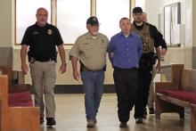(THOMAS WALLNER | THE GRAHAM LEADER) Seth Wakefield, 34, of Olney, is led down the hallway after being found guilty on two counts after five hours of jury deliberation, with the punishment being set after less than 10 minutes.