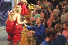 (THOMAS WALLNER | THE GRAHAM LEADER) Madi Wilde (left) speaks with her friends after being crowned All-American Girl in the All-American Girl Pageant held Saturday, Feb. 24 at Memorial Auditorium in Graham. Eight high school students participated in the event this year.