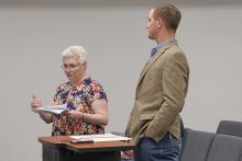 (THOMAS WALLNER | THE GRAHAM LEADER) Harper Perkins Architects (HPA) Architect/President Glenda Ramsey (left) and JD Coffee with Teinert Construction speak with the Graham ISD Board of Trustees during their meeting Wednesday, March 6.