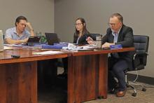 (THOMAS WALLNER | THE GRAHAM LEADER) Graham City Manager Eric Garretty (right) speaks Thursday, March 14 to the Graham City Council regarding space running out for purchasable plots at Pioneer Cemetery.