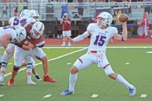 (TC GORDON | THE GRAHAM LEADER) Junior quarterback Ty Thompson (15) sets to throw a pass to one of his receivers in Graham’s opening game Friday, Aug. 25 against Bowie High. Thompson led the Steers offense to a dominant win 56-14.