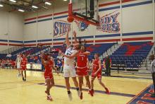 (TC GORDON | THE GRAHAM LEADER) Graham’s Samuel Rodgers nails a reverse layup off an assist from Cash Bowen during the team’s 69-66 win over Sweetwater last weekend. The Steers started out strong and held off a comeback attempt to earn the win.