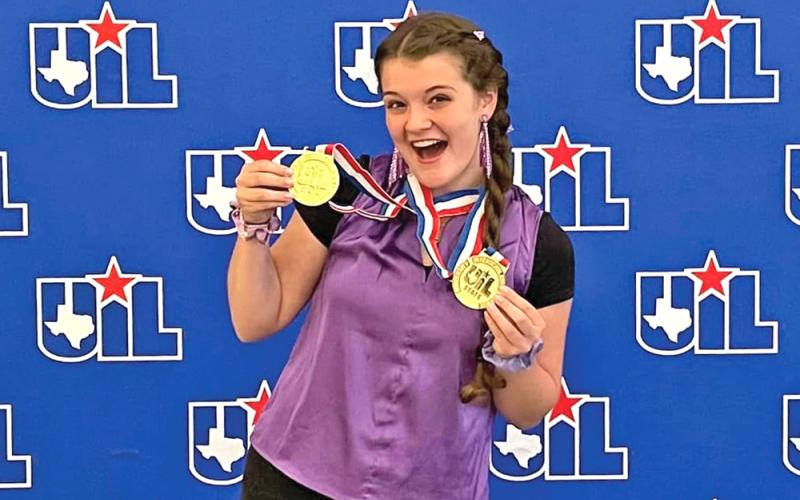 (NEWCASTLE ISD | CONTRIBUTED PHOTO) Newcastle student Ashleigh Taylor holds up her medals in May when she defended her state title in UIL 1A Mathematics. Taylor has competed in a number of UIL competitions. 
