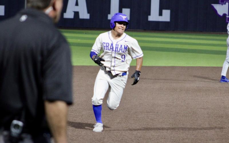(ALEX HAVARDANSKY | THE GRAHAM LEADER) Mike Garcia races to third base in the bottom of the sixth Thursday, May 22 against the Brock Eagles. Garcia presented a late scoring opportunity for Graham.  