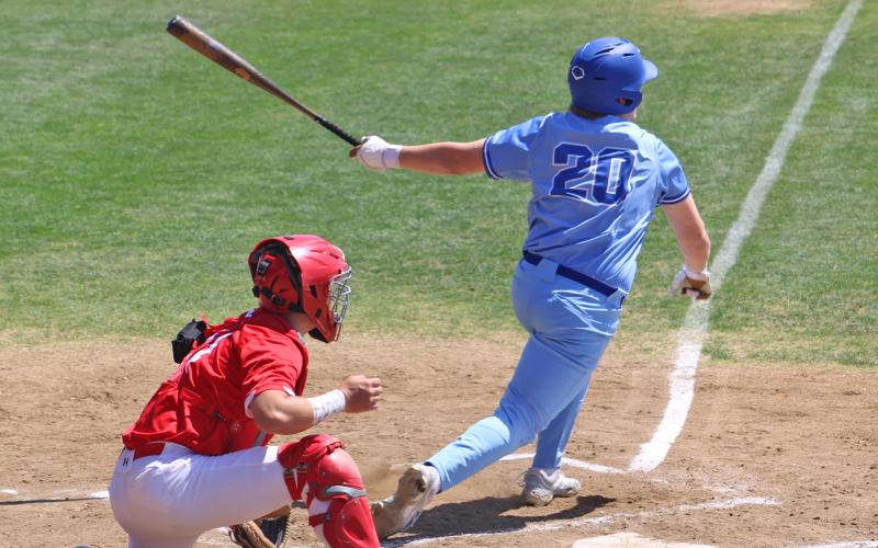 (ALEX HAVARDANSKY | THE GRAHAM LEADER) Colter Johnson sends a ball into the outfield Saturday, April 12. Johnson came through with the most momentum shifting hit of the game with a bases clearing RBI triple. 
