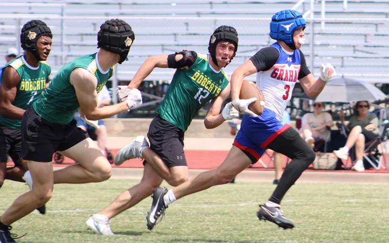 (ALEX HAVARDANSKY | THE GRAHAM LEADER) Parker Hale runs away from defenders to the endzone for a touchdown Saturday, May 24 against Benbrook. Hale erupted in the second half of that matchup with two scores on back-to-back drives.
