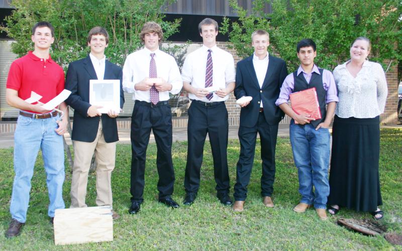 (ARCHIVE PHOTO | THE GRAHAM LEADER) Clark Miracle, Ben Davis, Jerrod Mahan, Janson Graham, Travis Gipson, Jonathon Gonzales and teacher Michelle Lowrey prepare for the Technology Student Association’s 2012 national convention in Nashville, Tennessee. Graham High School competed with TSA for the first time and scored second overall with six students advancing to national competition with their projects.