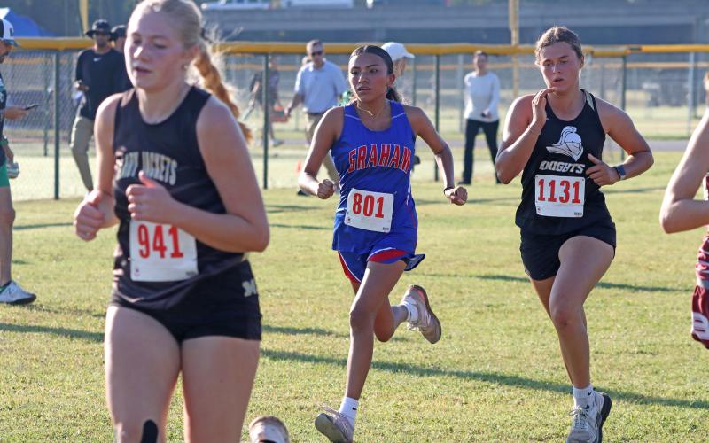 (KYLIE BAILEY | THE GRAHAM LEADER) Angela Fuentes creates separation between runners during the Thrill of the Hill Invitational which took place Wednesday, Oct. 1. Fuentes finished 63 out of 161 runners during the girls 3.2k run. 