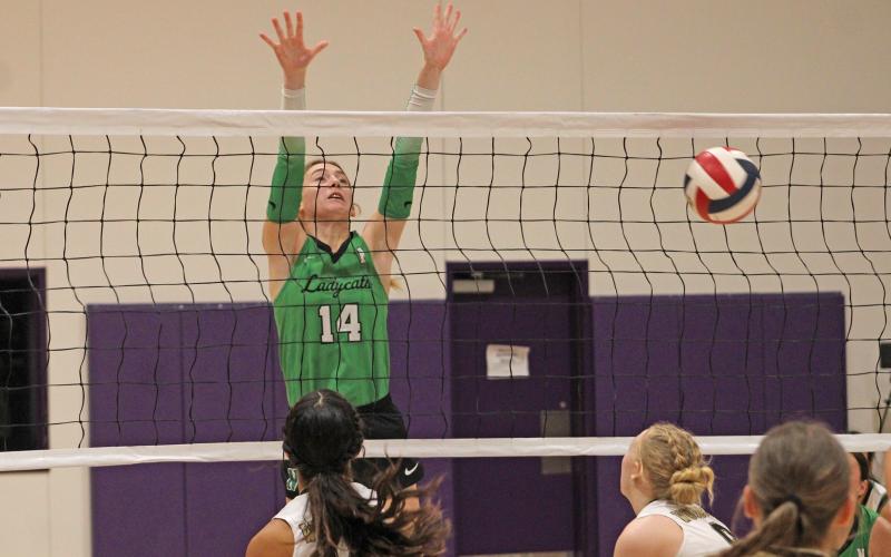 (ALEX HAVARDANKSY | THE GRAHAM LEADER) Aubree Clayton goes up for a block Saturday, Aug. 16, against Woodson. The Ladycats lost in their championship matchup. 