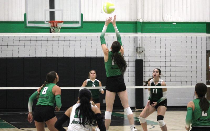 (ALEX HAVARDANKSY | THE GRAHAM LEADER) Aubree Clayton returns a ball Tuesday, Aug. 26, against Breckenridge. Clayton picked up three blocks on the night.