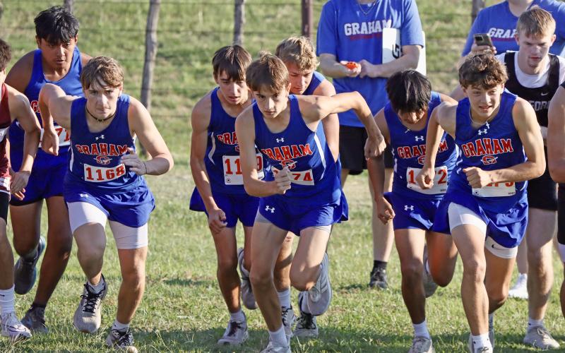 (KYLIE BAILEY | THE GRAHAM LEADER) Members of the Steers cross country team take off in the varsity 5K run Wednesday, Sept. 17. The Steers and Lady Blues participated in the Battle of the Back 40 in Poolville.