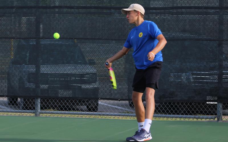 (ALEX HAVARDANKSY | THE GRAHAM LEADER) Brooklyn Tarsoaga takes a swing at a ball in a singles match. Tarsoaga fought hard in a 8-5 singles loss against Iowa Park. 