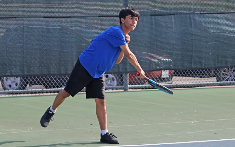 (ALEX HAVARDANSKY | THE GRAHAM LEADER) Jordan Miranda serves a ball Saturday, Aug. 2. Miranda and his teammate Raife Bishop picked up the lone doubles win for the Steers against Brownwood. 