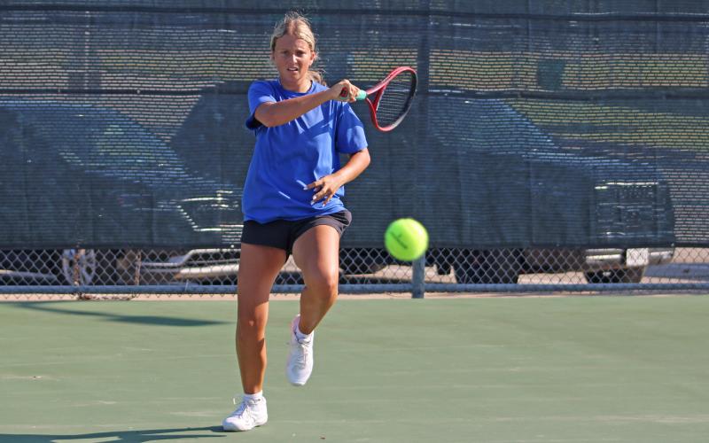 (ALEX HAVARDANSKY | THE GRAHAM LEADER) Kline Krupp returns a ball Saturday, Aug. 2. The Graham tennis team lost to Brownwood 11-8. 