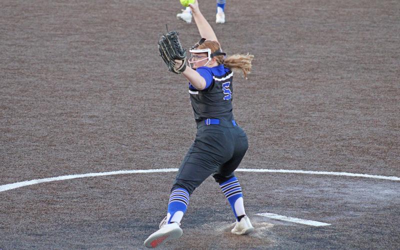 (MIKE WILLIAMS | CONTRIBUTED PHOTO) Pitcher Reese Calhoun winds up and fires a pitch home during the first game of Graham’s bi-district series against Lubbock Estacado. The Lady Blues defeated the Lady Matadors in two straight games to claim the bi-district championship.