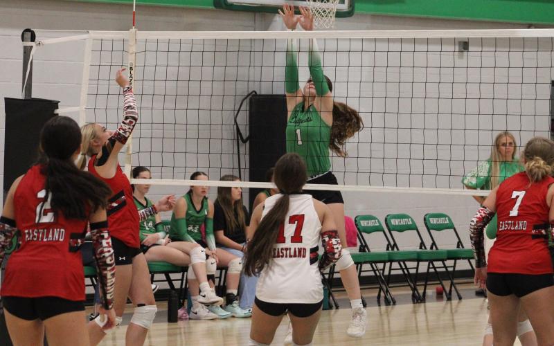 (ALEX HAVARDANKSY | THE GRAHAM LEADER) Camren Mallory goes up for a block Tuesday, Sept. 2, against the Lady Mavs. Newcastle defeated Eastland in four sets.